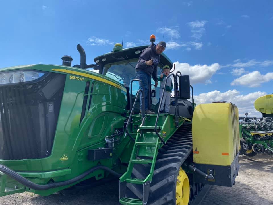 Chris Nelson on top of a John Deere planter