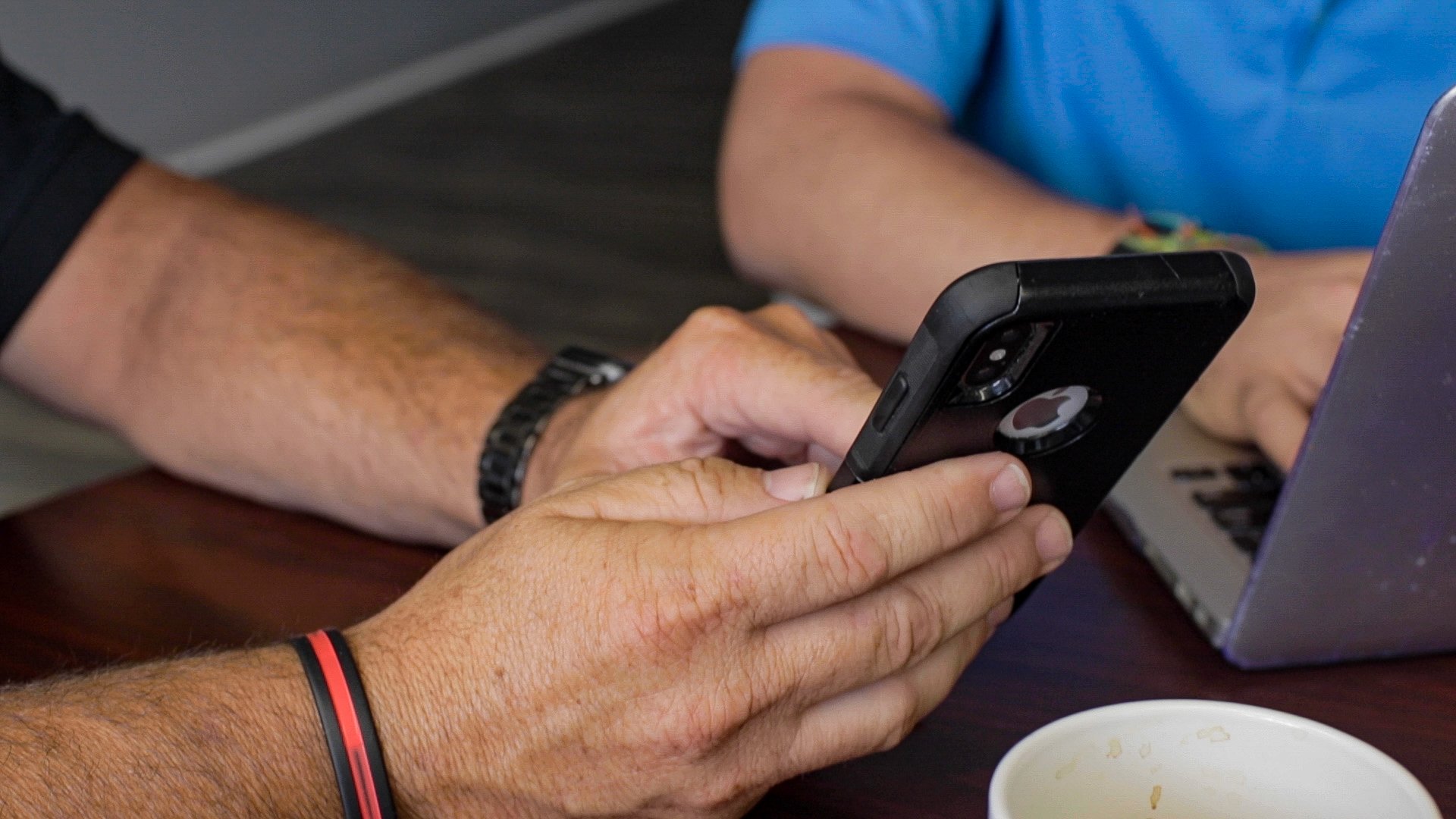 Close-up shot of hand holding phone